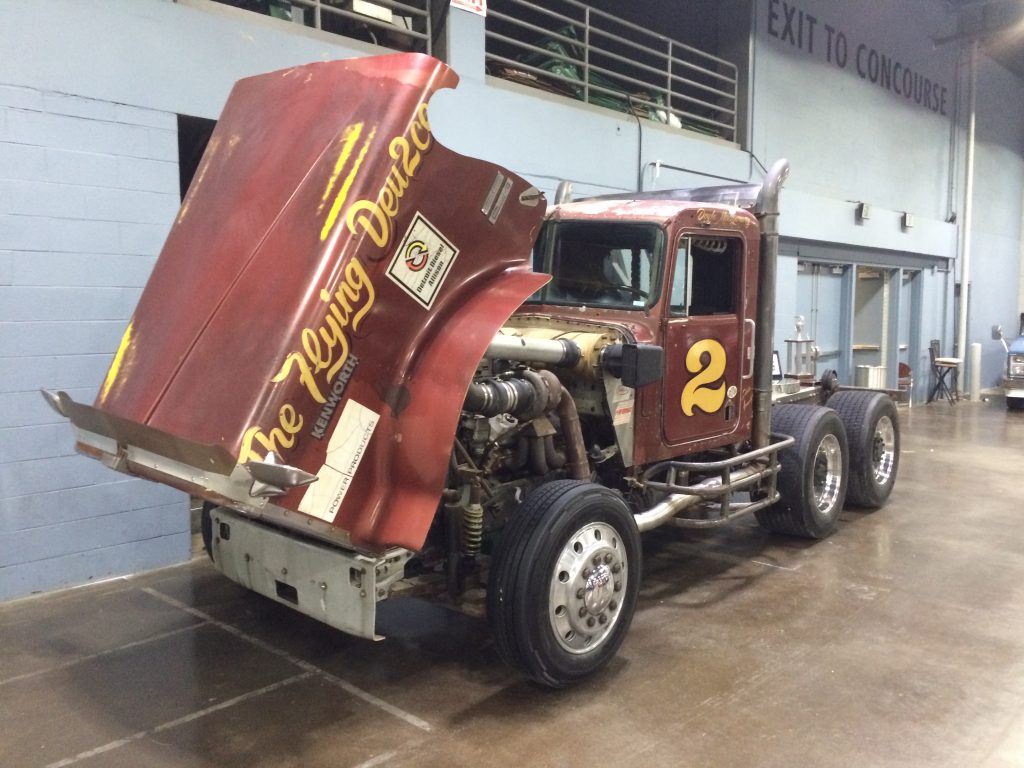 vintage kenworth semi truck at indoor car show