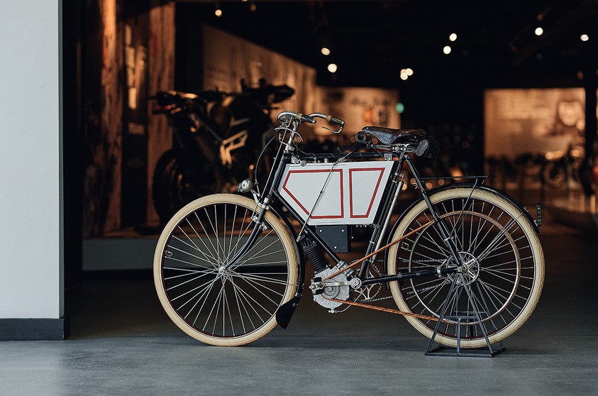 triumph prototype motorcycle 1901 in front of factory