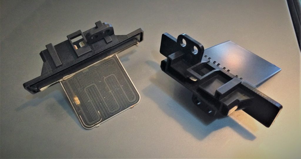 comparison of old and new side by side blower motor resistors for a 2004 nissan sentra