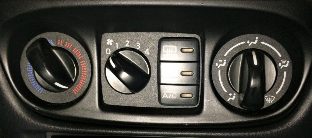 close up of hvac controls for a 2004 nissan sentra