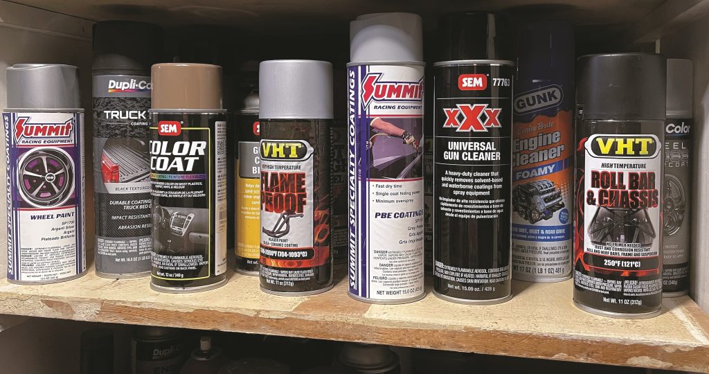 rattle can spray cans on workshop shelf