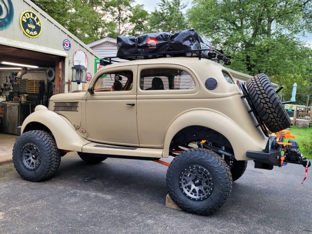1936 ford overlanding hot rod coupe in driveway