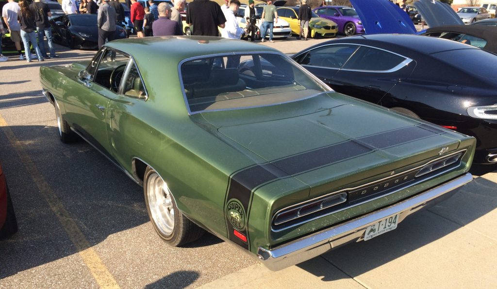 green dodge super bee at a car show