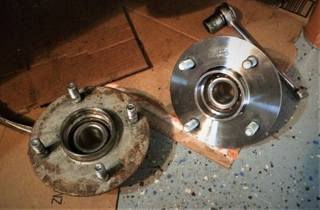 a side by side comparison of an old and new rear wheel bearing for a 2004 nissan sentra