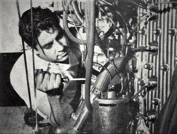 pancho gonzalez works on a flathead ford engine in a vintage photograph