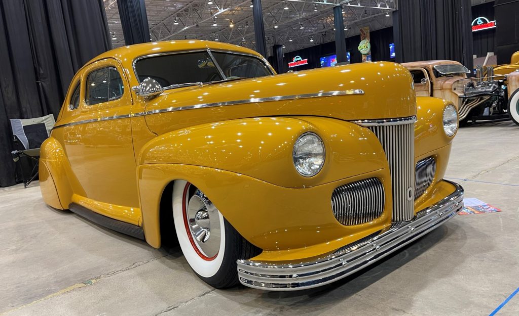 1941 ford coupe hot rod yellow at indoor car show