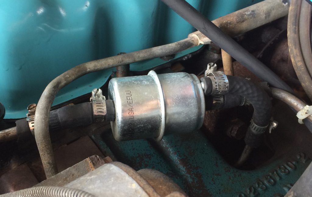 dual outlet fuel filter installed on an amc 258 engine right ahead of carburetor
