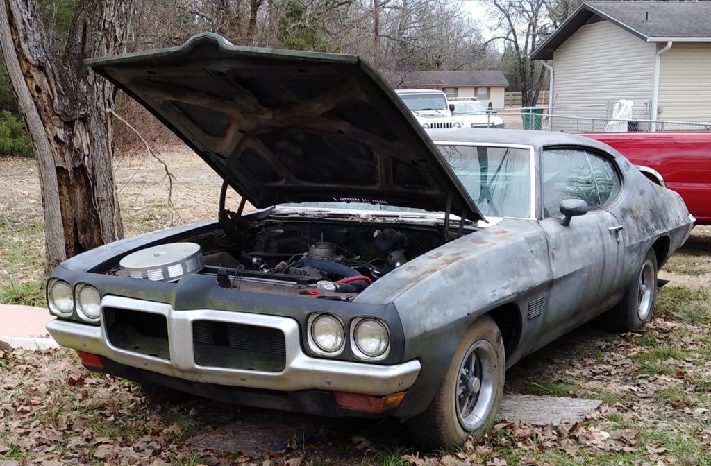 1970 pontiac le mans sport project car with hood up and air cleaner on radiator support