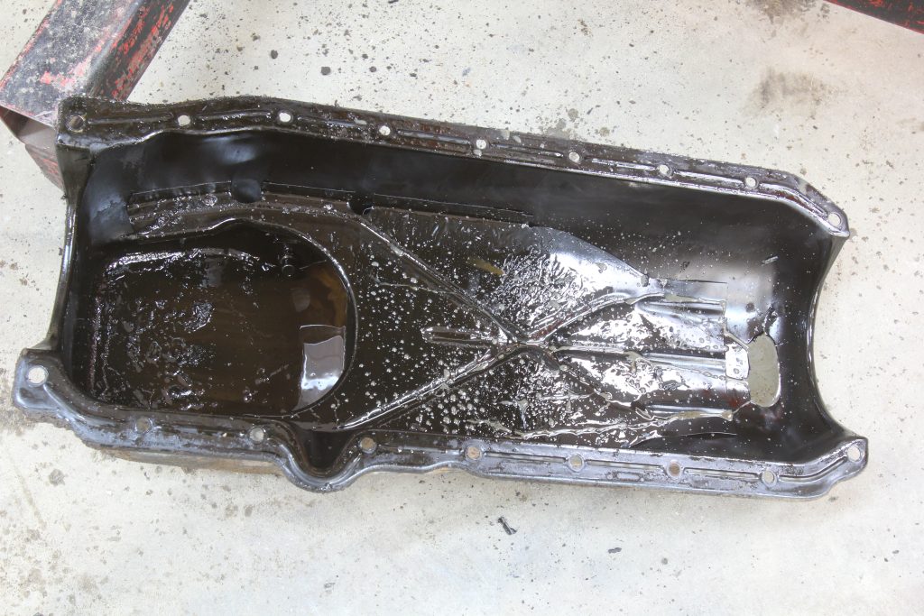 chevy small block v8 oil pan filled with oil sludge and gunk