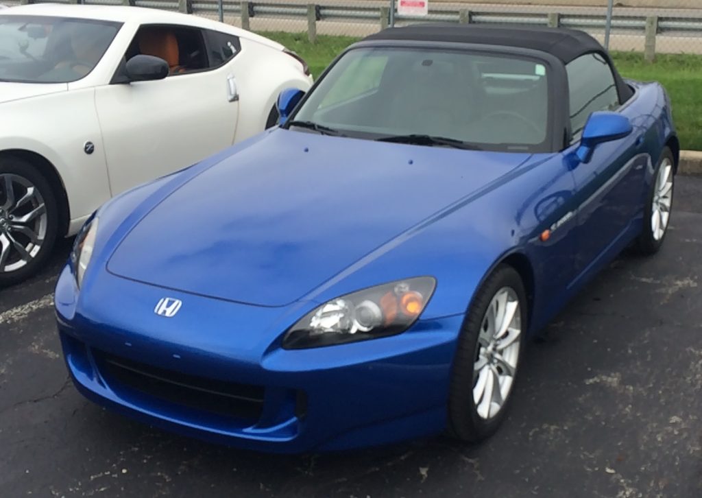 blue honda s2000 convertible at car show