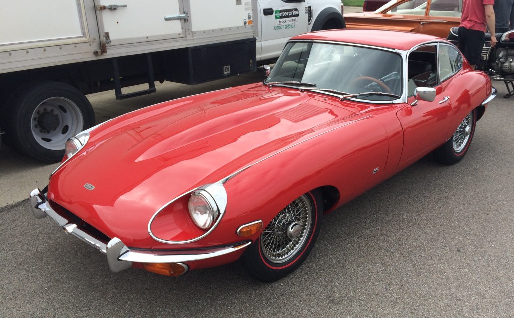 red jaguar e-type xke coupe at classic car show