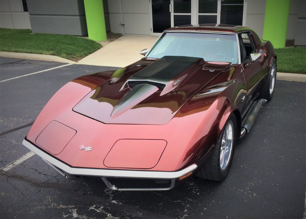 front shot of a red custom 1971 chevy corvette stingray equipped with a modified sting ray stinger hood