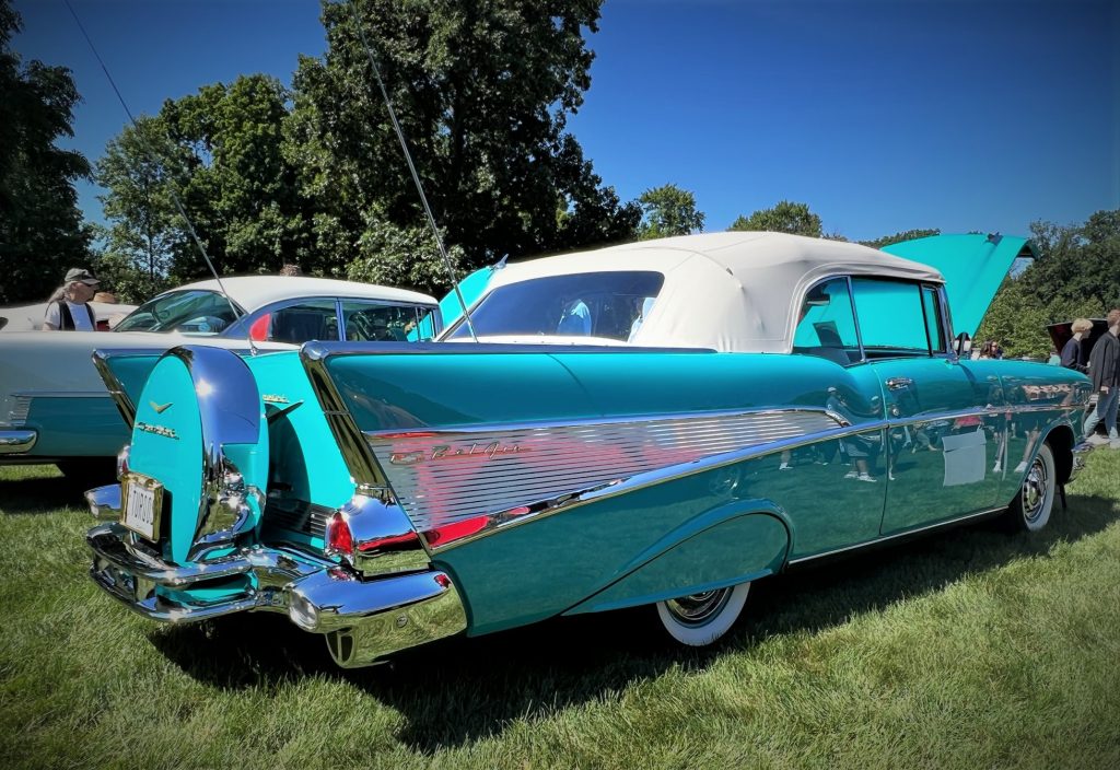 close up of the tailfins of a turquoise 1957 chevy bel air convertible