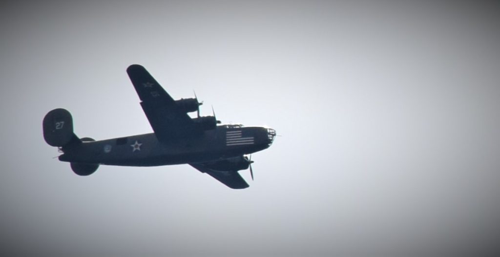 world war 2 era consolidated b-24 liberator heavy bomber in flight during a vintage military vehicle show in cincinnati ohio