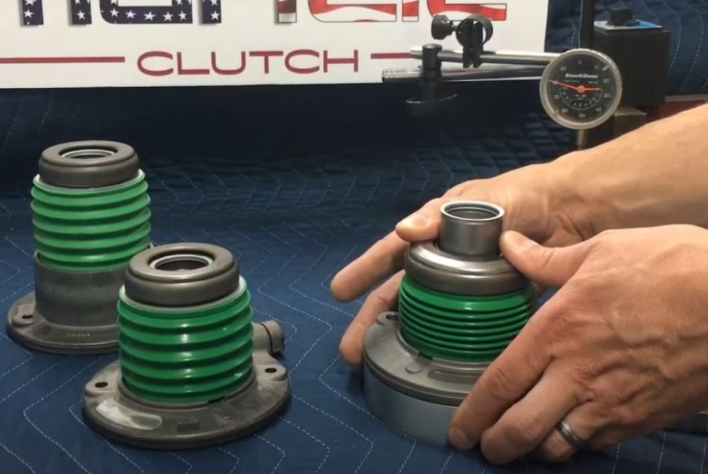 a collection of hydraulic throwout bearings for a clutch arranged on a table