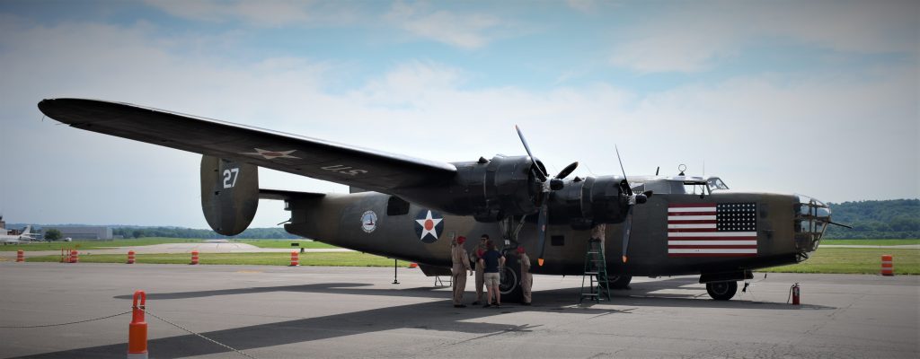world war 2 era heavy bomber, the b-24 liberator called diamond lil sitting on runway at vintage military aircraft show