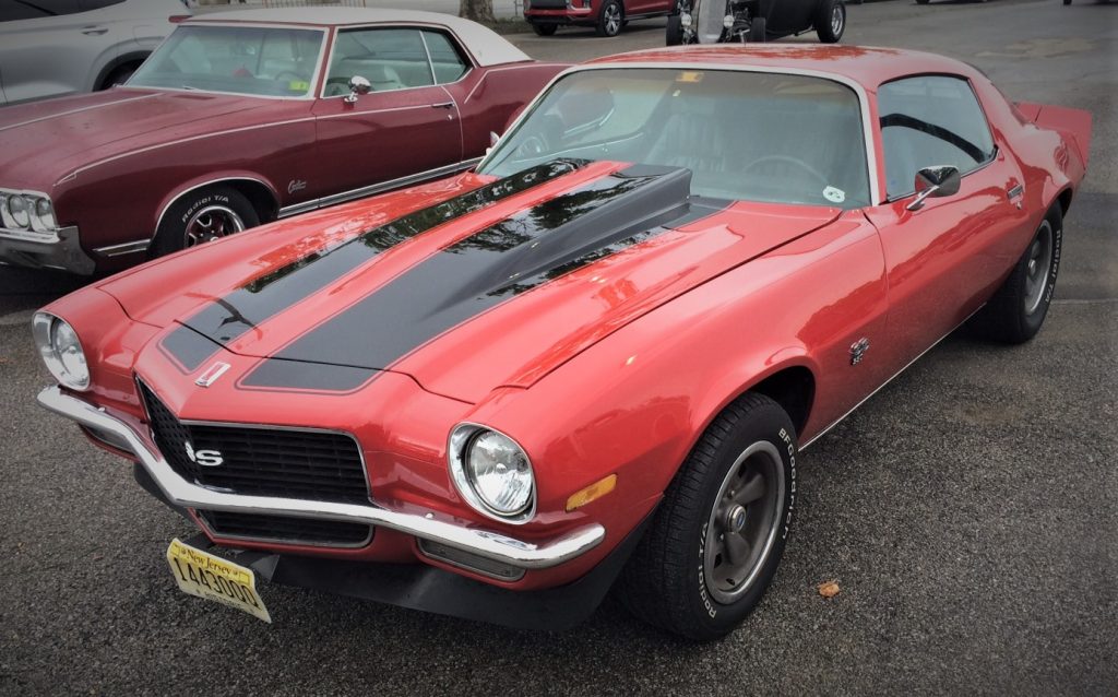 second gen solid bumper chevy camaro ss at a classic car show