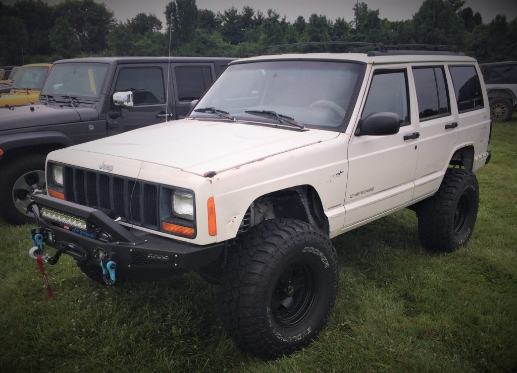 a white jeep cherokee xj modified off roader