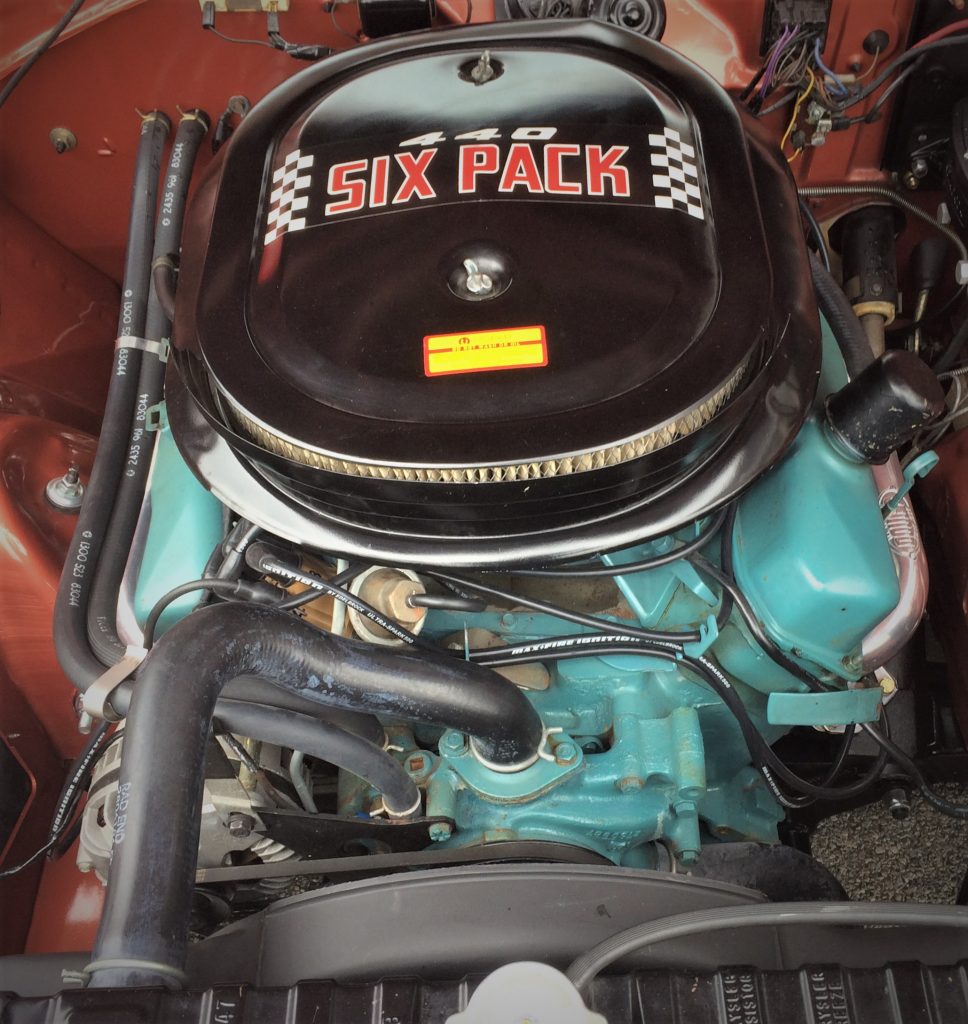 a chrysler 440 big block v8 under the hood of a classics muscle car mopar