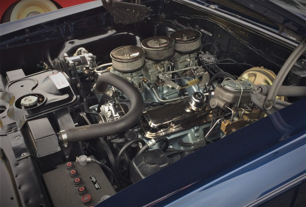a pontiac 455 v8 engine under the hood of a classic GTO muscle car