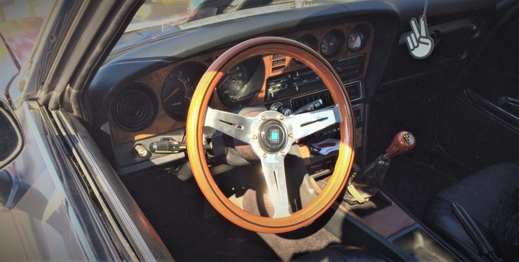 interior picture of the nardi steering wheel on a silver 1977 toyota celica gt sports car