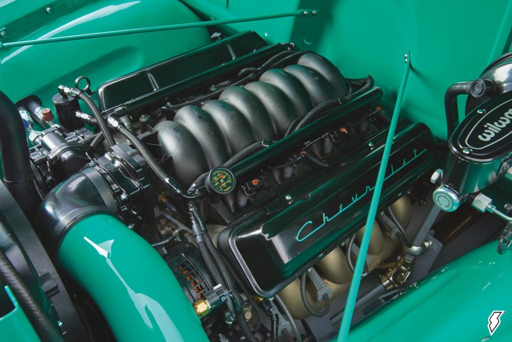 close up of engine bay and the ls6 enigne powering a 1952 chevy suburban that's been cusotmized