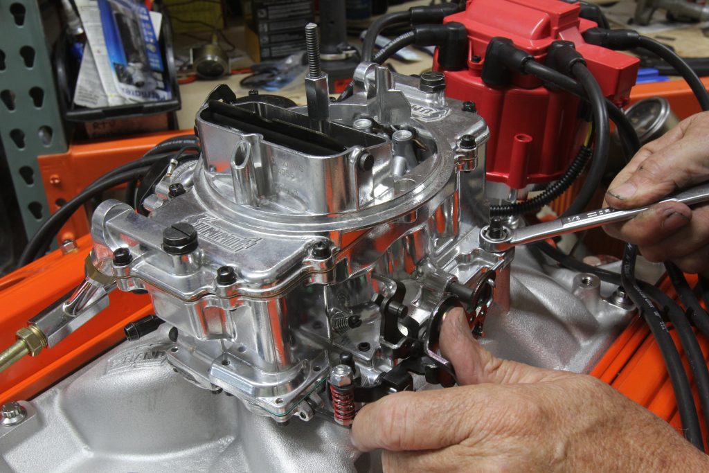 close up of summit racing 750 cfm carburetor prior to installation on 355 small block chevy v8
