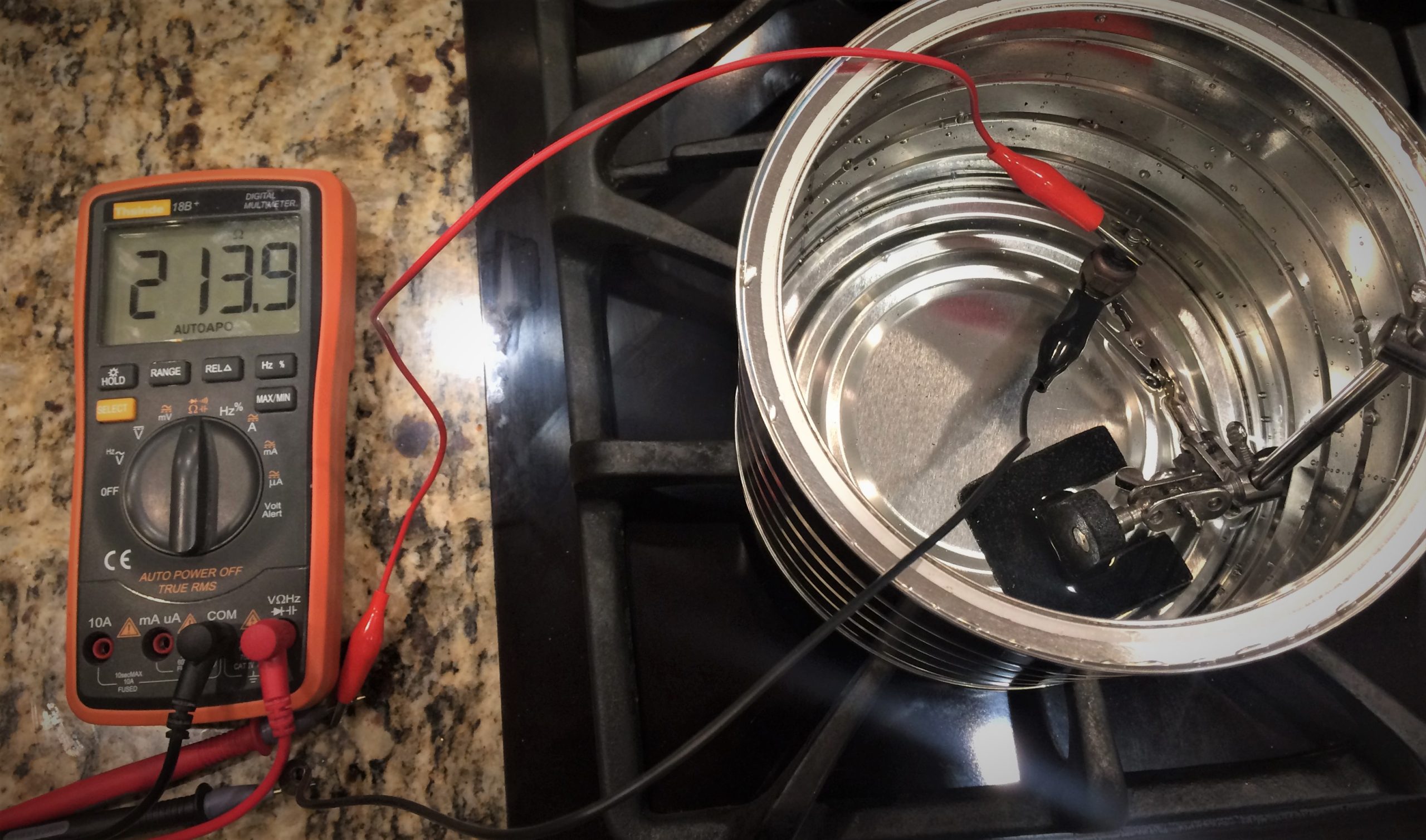 https://www.onallcylinders.com/wp-content/uploads/2022/07/28/testing-electrical-water-temprature-gauge-sending-unit-in-kitchen-with-multimeter-scaled.jpg