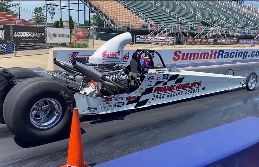 dragster from frank hawley's drag racing school ready to launch at drag strip