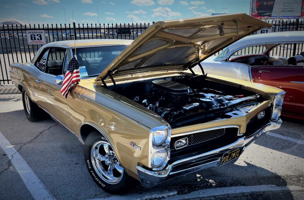1967 gold pontiac gto with hurst equipped badge