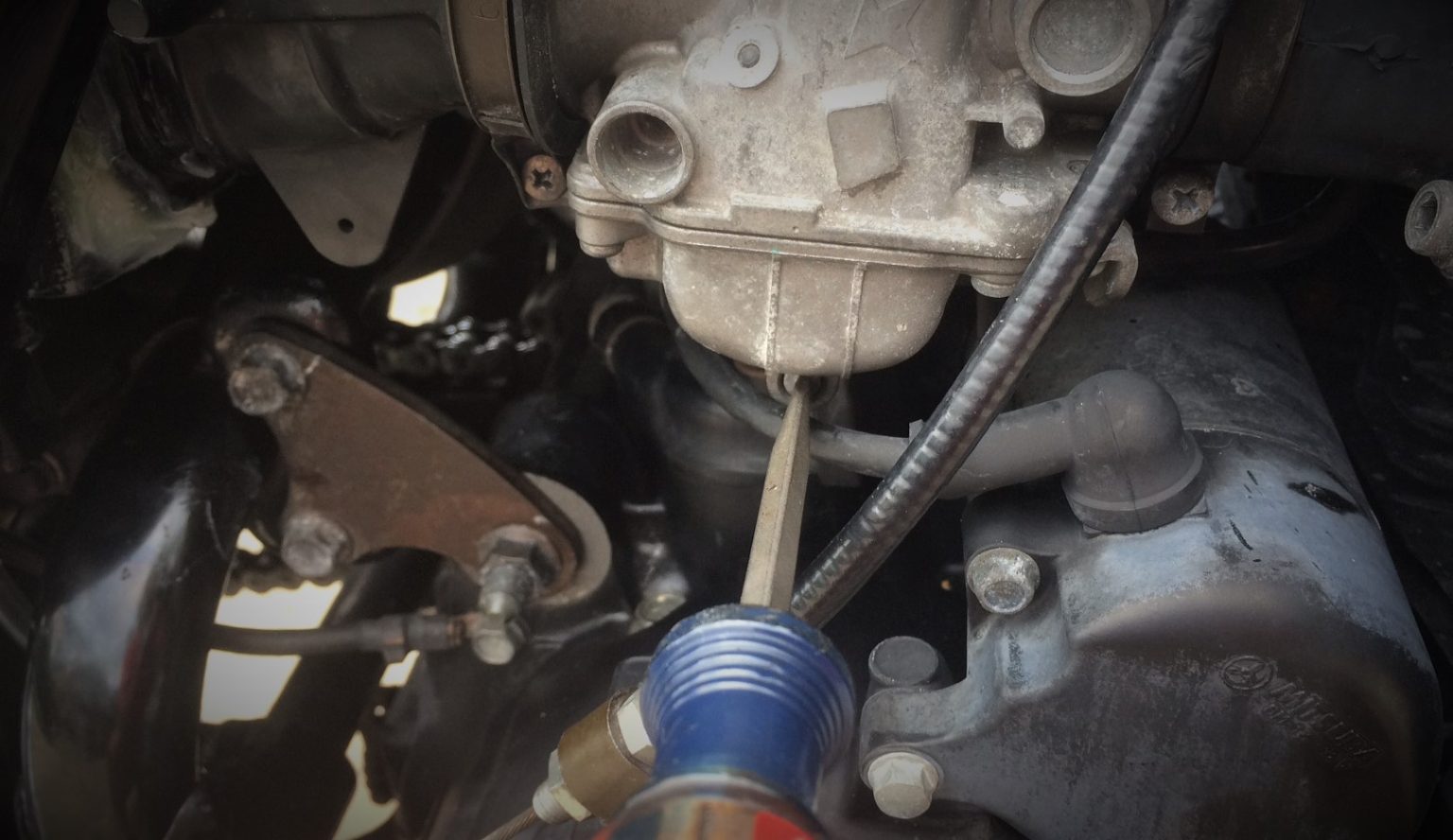 How a Stuck Carburetor Fuel Shutoff Float Valve Led to a PoorRunning Motorcycle (& How it Got