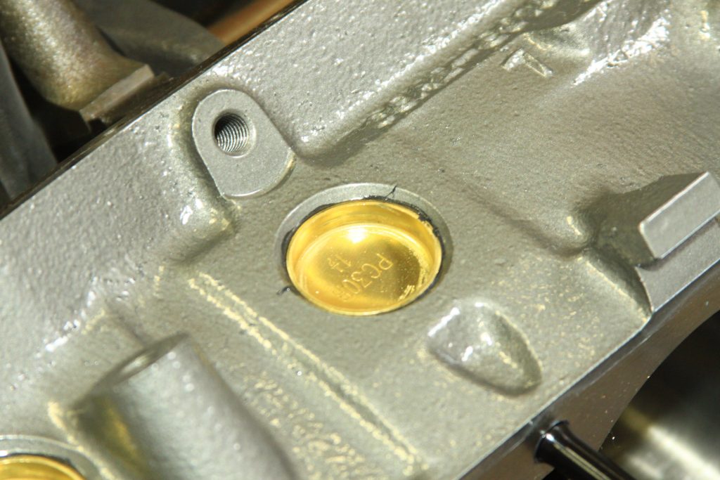 brass freeze plugs installed in engine