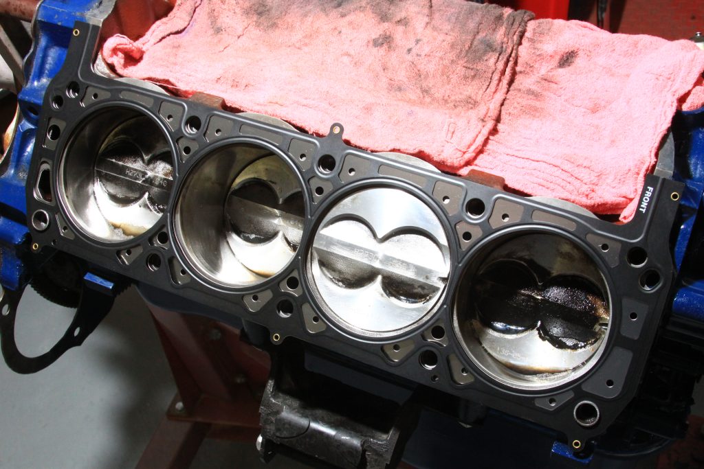 cylinder head gasket laying on engine deck to show coolant passages