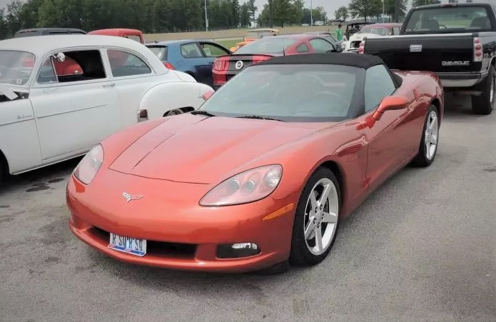 C6 copper red corvette at car show