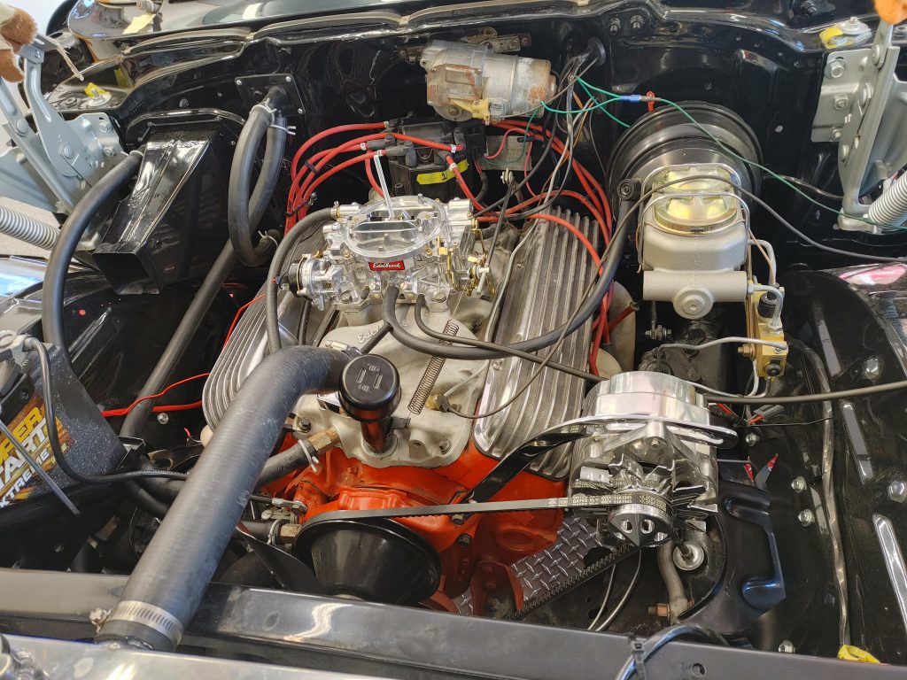 a small block chevy v8 engine in an old car