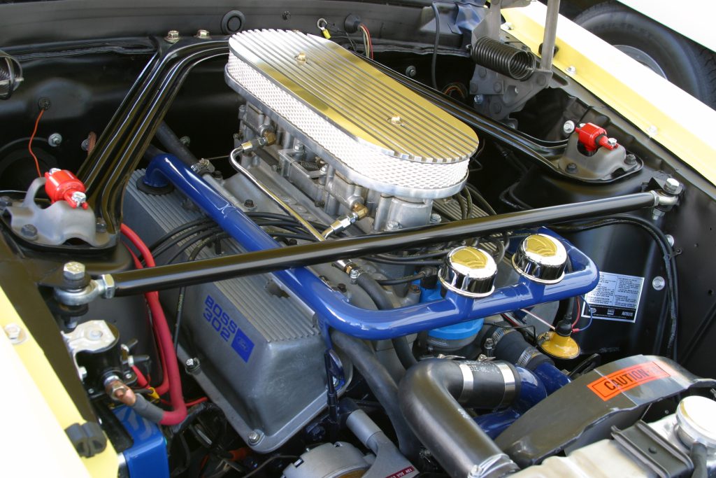 autolite inline 4 barrel carburetor on a boss 302 ford engine with air cleaner