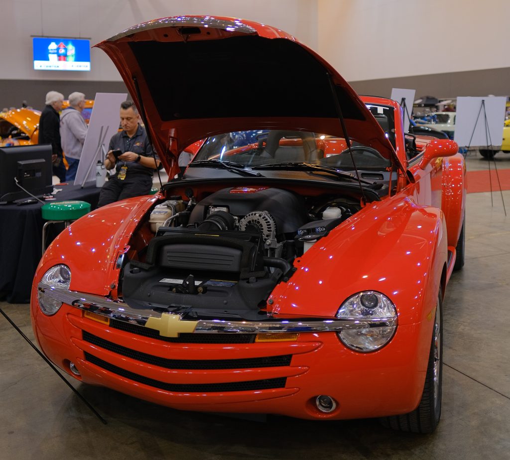 red chevy ssr convertible truck with its hood open
