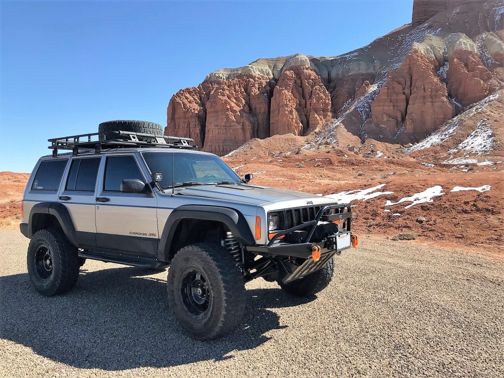 jeep Cherokee xj off roading on a desert trail