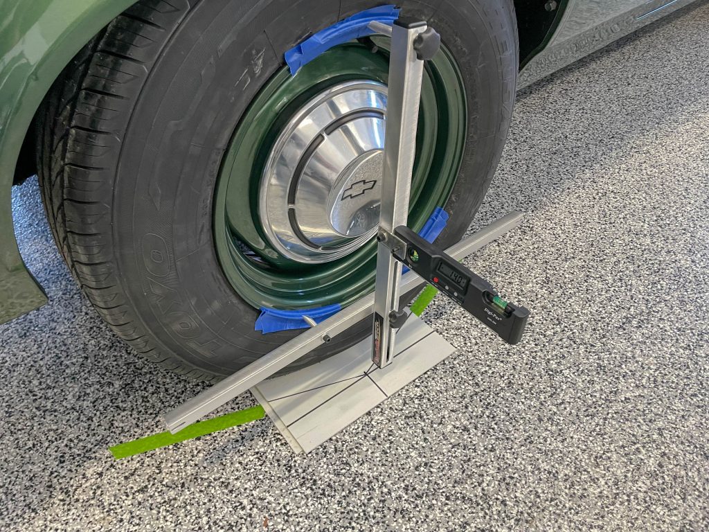 tire and wheel getting aligned in home garage