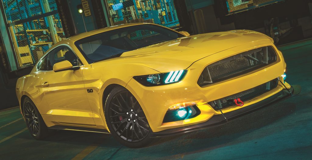 Yellow 2015 Ford Mustang 5.0L on Street At Night