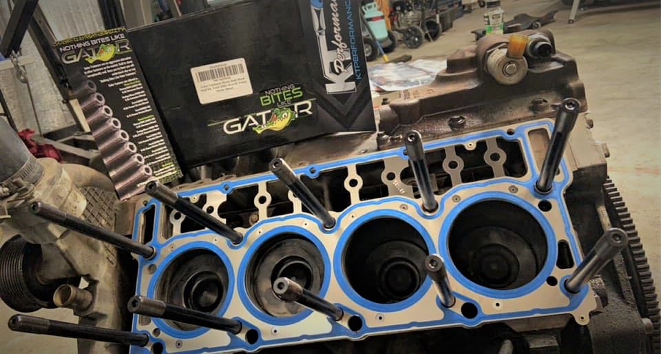 Gator Fasteners Head Studs Being Installed on a Diesel Engine