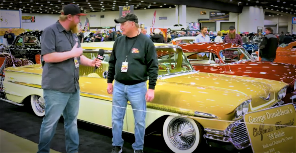 2 men talking about a customized 1958 Chevy Bel Air california style