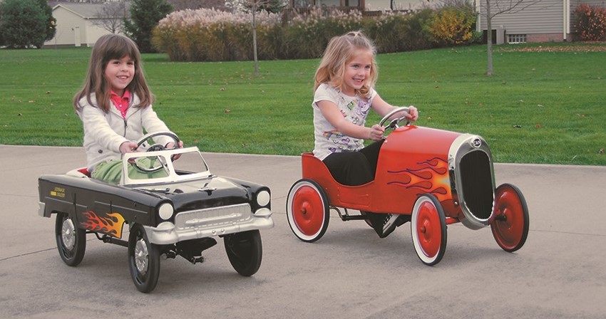 https://www.onallcylinders.com/wp-content/uploads/2023/06/22/2-girsl-riding-on-2-pedal-car-toys.jpg