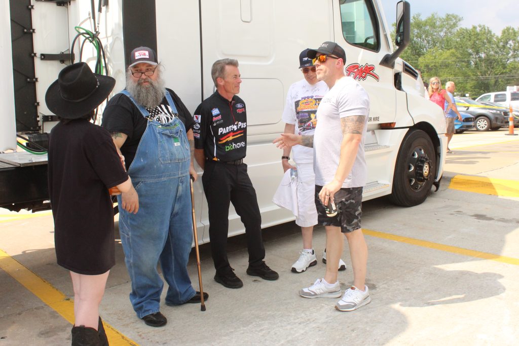 clay millican talking with fans at meet and greet nhra event