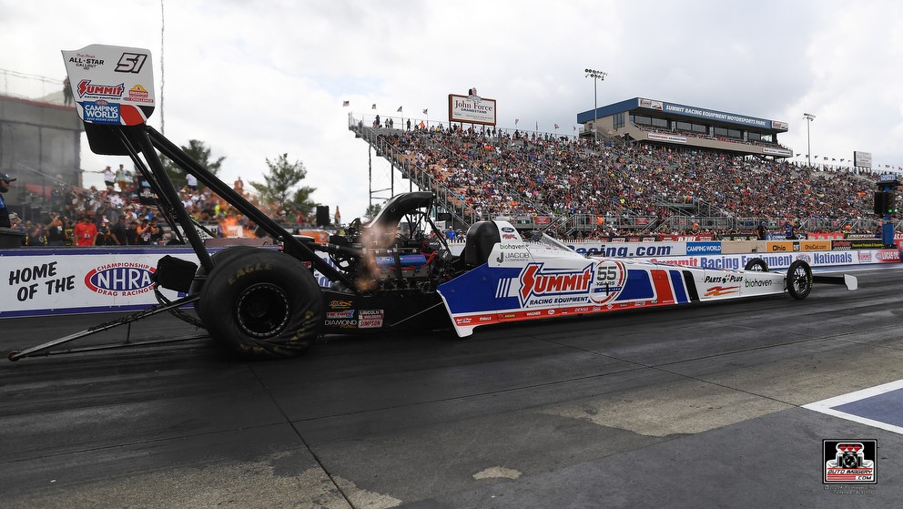 clay millican's nhra top fuel dragser launching with summit racing 55th livery