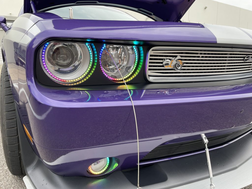 close up of halo headlights on dodge challenger late model