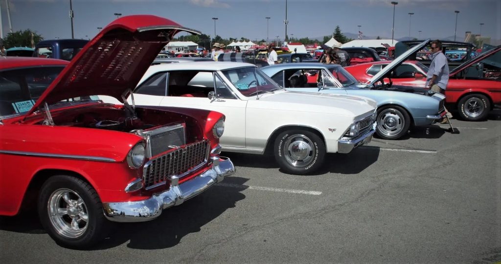 Row of vintage classic cars at a large car show cruise in