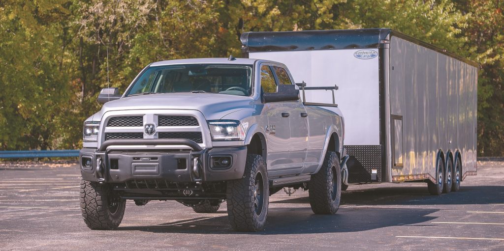 2018 Ram 2500 truck in parking lock hitched up to a race car trailer