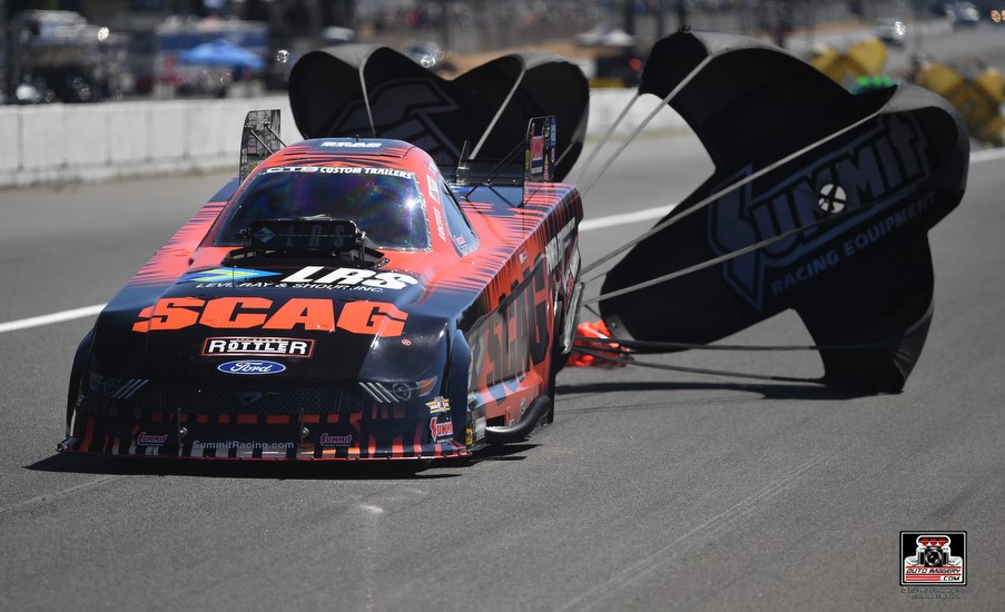 tim wilkerson nhra funny car at end of a run with chutes deployed at 2023 northwest nationals