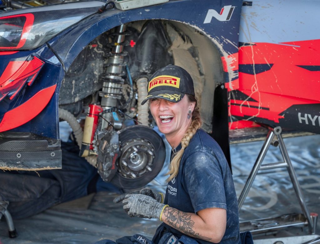 Heather Holler working on suspension of a Hyundai Rally Car